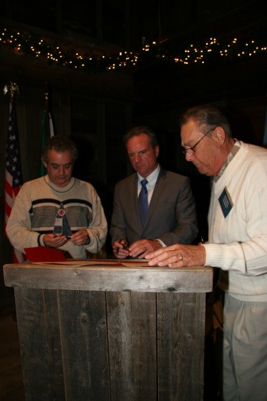 Men signing documents