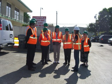 Recyclery Tour - men in orange vests, green helmets