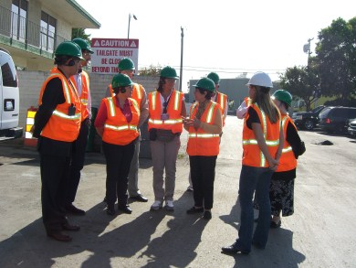 Recyclery Tour - men in orange vests, green helmets